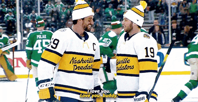 two men wearing nashville predators jerseys are talking