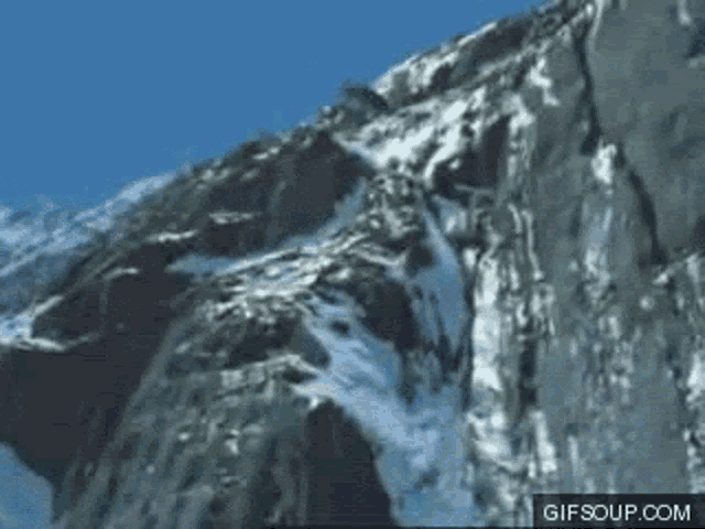 a gif of a snowy mountain with the website gifsoup.com visible