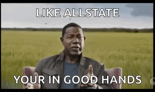 a man is sitting in a chair with his hands out in front of a field and says `` like allstate your in good hands '' .