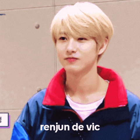 a young man wearing a blue and red jacket with the words renjun de vic on the bottom