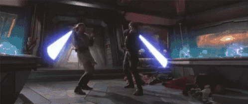 two men are fighting with lightsabers in a room with a blue light coming out of their hands .