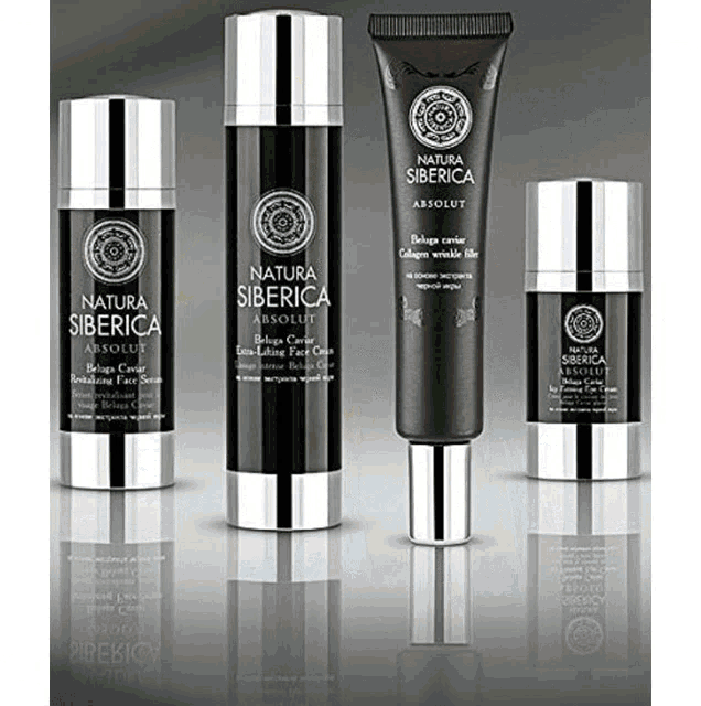 four bottles of natura siberica absolute are lined up on a white surface
