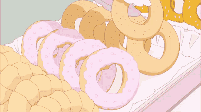 a bunch of donuts are stacked on top of each other on a white surface