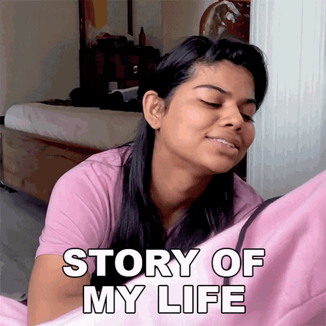 a woman in a pink shirt is smiling with the words story of my life below her