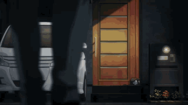 a car is parked in front of a house with a door open