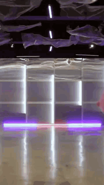a room with a lot of neon lights on the walls and ceiling