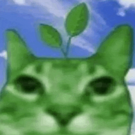 a close up of a green cat with a plant growing out of its head .