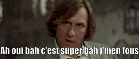 a man in a suit and tie says ah oui bah