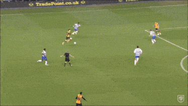 a group of soccer players are celebrating a goal in front of a williamhill banner