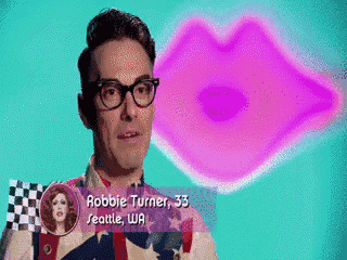 a man with glasses and the name robbie turner is standing in front of a pink lips