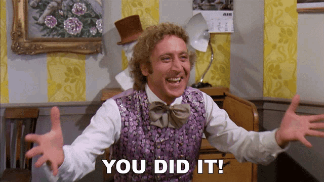 a man in a purple vest and bow tie says " you did it "