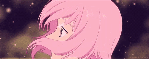 a close up of a girl 's face with pink hair and a starry sky in the background .