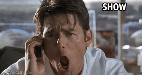 a man yawning while talking on a cell phone with the word show above his head