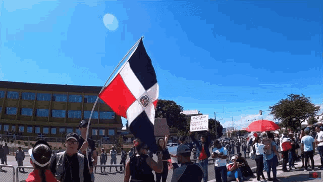 a group of people holding a flag and a sign that says " esperanza "