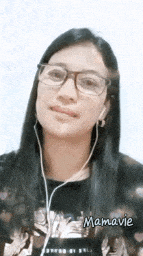 a woman wearing glasses and earbuds has the name mamavie on the bottom