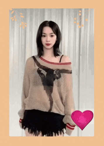 a woman wearing a sweater with a picture of a man on it