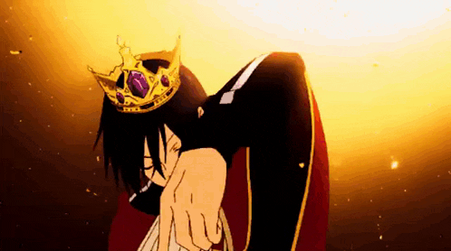 a man is wearing a crown and pointing at the camera .