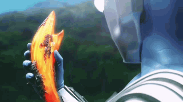 a blue robot is holding a piece of orange material in his hands