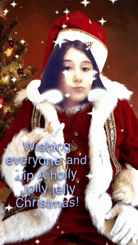 a girl dressed as santa claus wishes everyone a holly jolly christmas