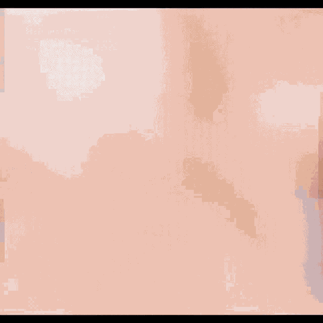 a blurry picture of a woman 's face with a pink background