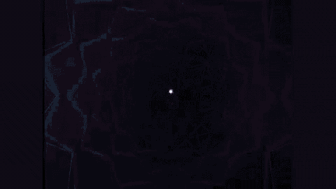 a glowing light in the dark with a purple glow
