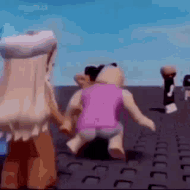 a group of dolls are standing next to each other on a brick floor .