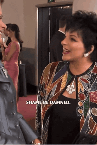 a woman wearing a sequined jacket says shame be damned
