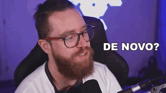 a man with a beard wearing glasses and headphones says de novo