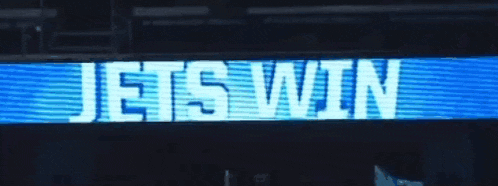 jets win is displayed on a blue and white sign