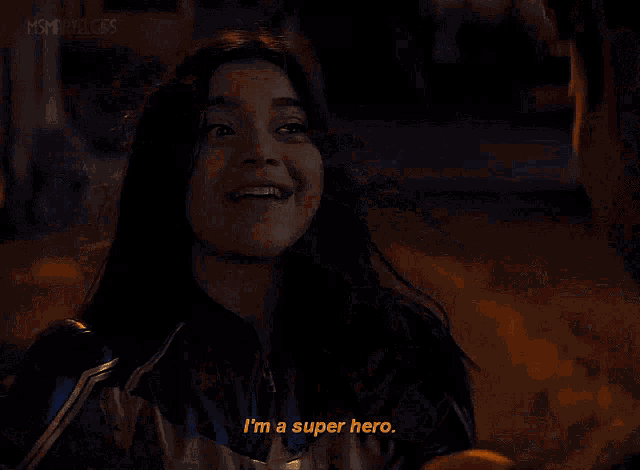a woman in a superhero costume is running down a street at night and says i 'm a super hero