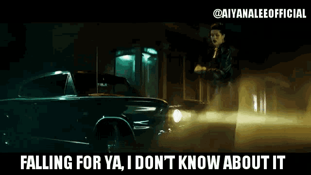 a woman is standing next to a car that says " falling for ya i don 't know about it "