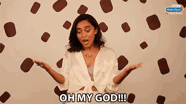 a woman says oh my god in front of a wall covered in chocolate chips