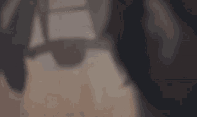 a close up of a person 's face with a shadow on it