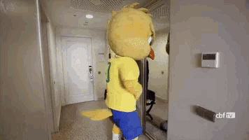 a mascot in a yellow shirt with the number 8 on it