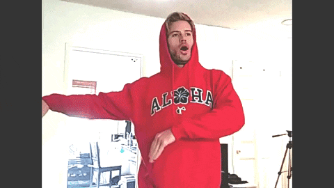 a man in a red hoodie that says aloha on it