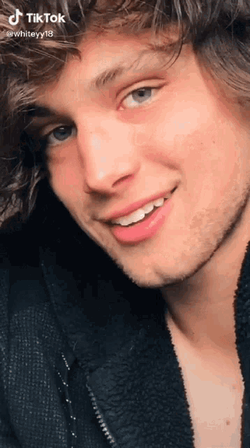 a close up of a man 's face with a tiktok watermark on it