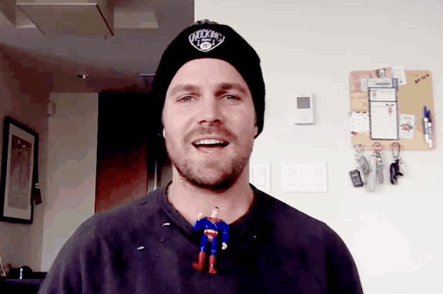 a man wearing a beanie that says new york knicks