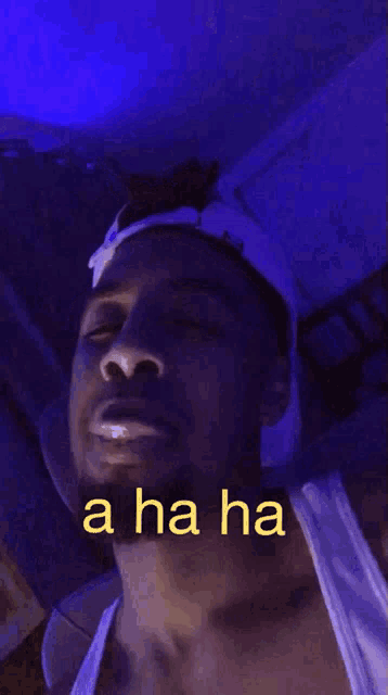a man is laughing with the words a ha ha written on the bottom