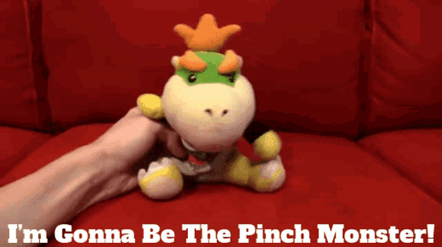 a stuffed animal with the words " i 'm gonna be the pinch monster " below it