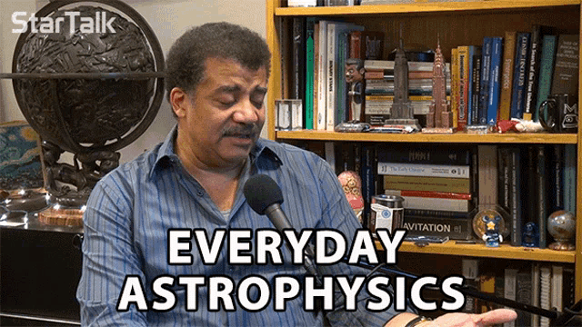 a man talking into a microphone with the words " everyday astrophysics " on the bottom
