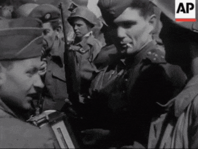 a black and white photo of a group of soldiers with ap written on the bottom
