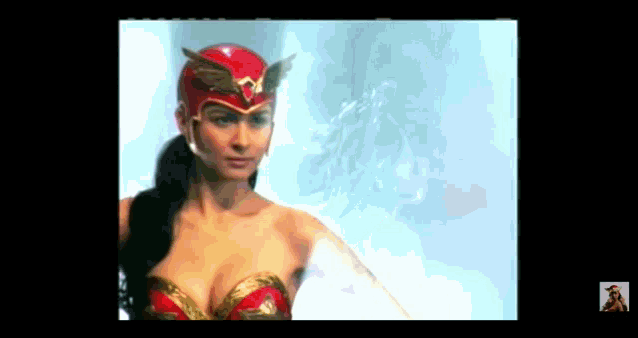 a woman in a superhero costume with wings on her helmet