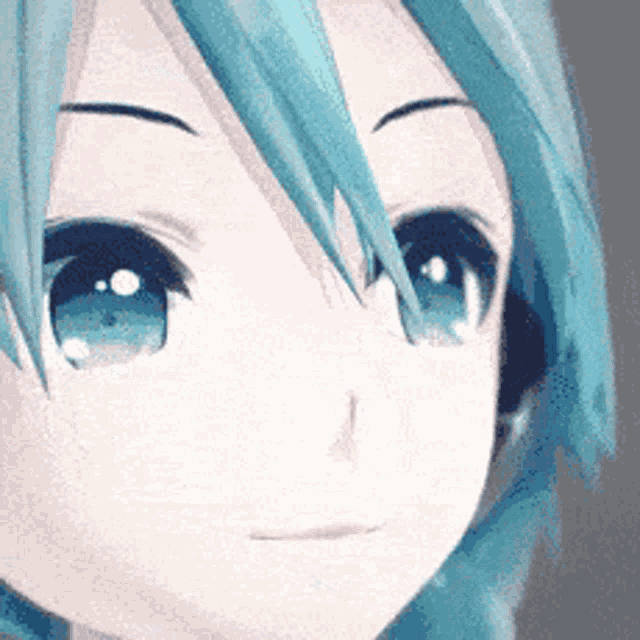 a close up of a girl 's face with blue eyes