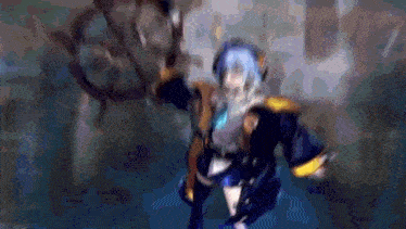 a blurry picture of a person holding a sword in their hand .