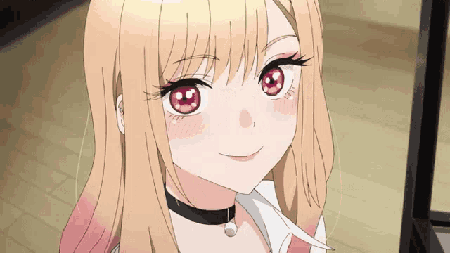 a girl with blonde hair and red eyes is smiling