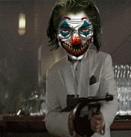 a clown is holding a gun in a dark room