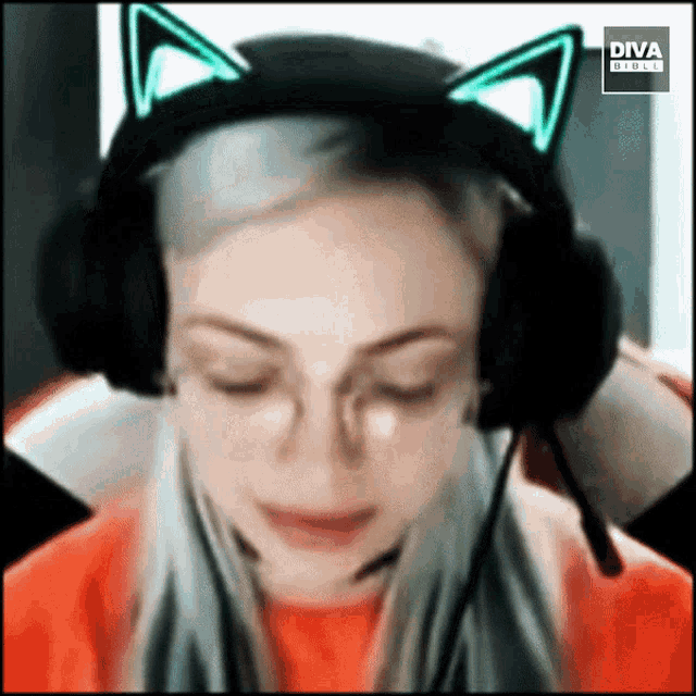 a woman wearing headphones with cat ears and a diva direct logo behind her