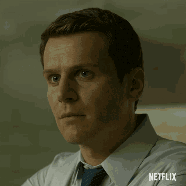 a close up of a man 's face with the word netflix on the bottom