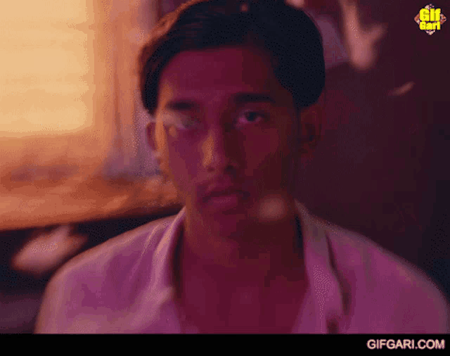 a close up of a man 's face with the website gifgari.com visible in the corner