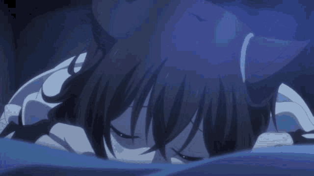 a girl with a cat ear is laying on a bed with her eyes closed